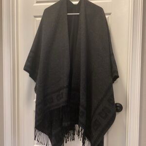 Elegant Black Wool Open Poncho Cape for Women with Geometric Pattern and Fringe.